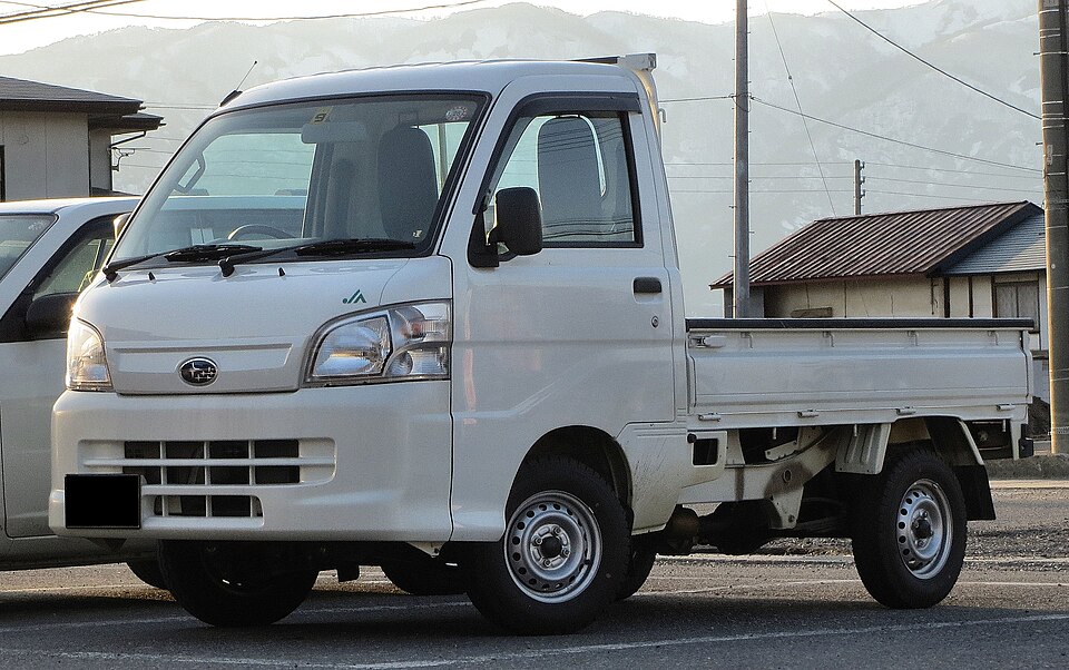 A white Subaru Sambar mini truck.