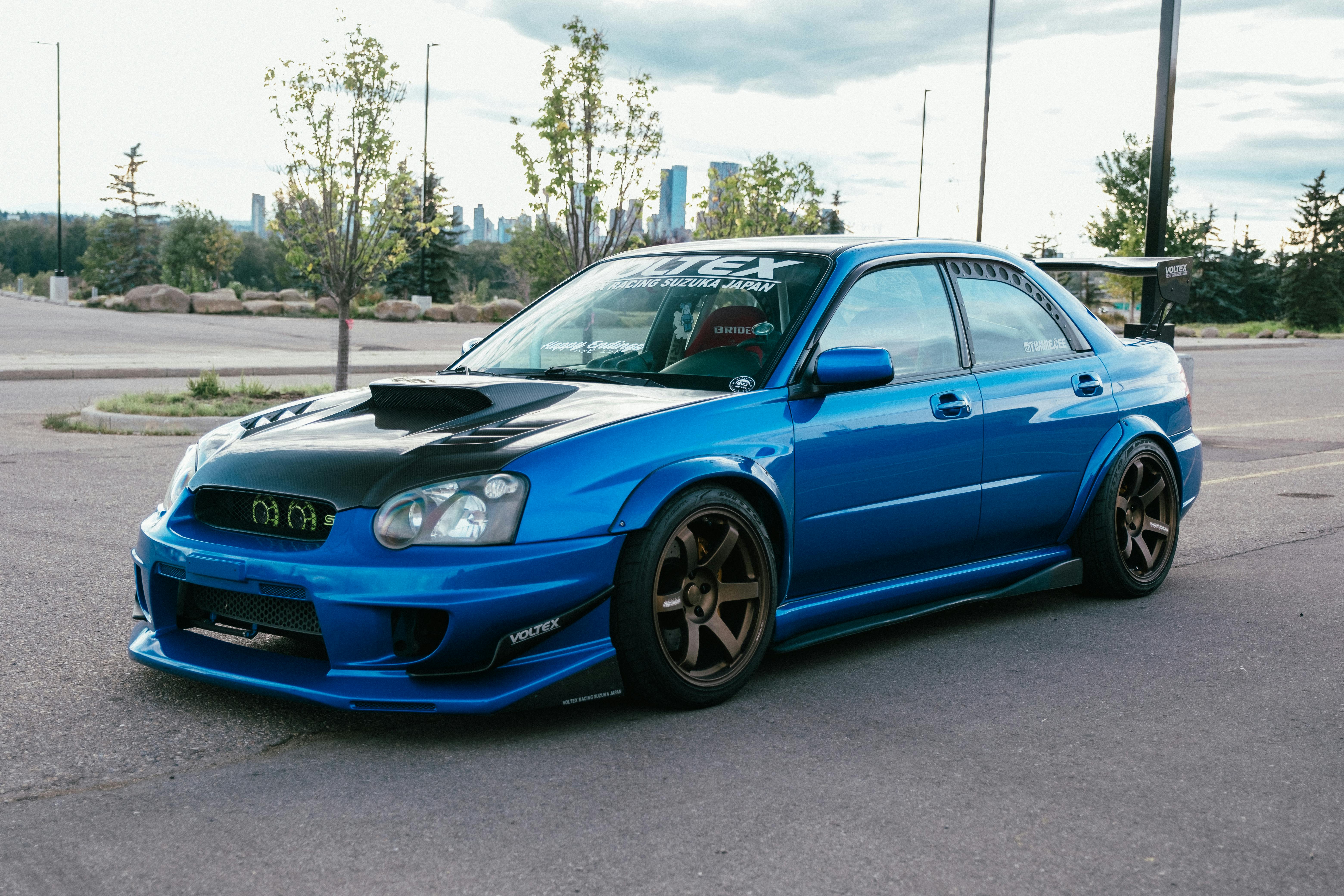 Blue Modified Subaru STI in Urban Setting
