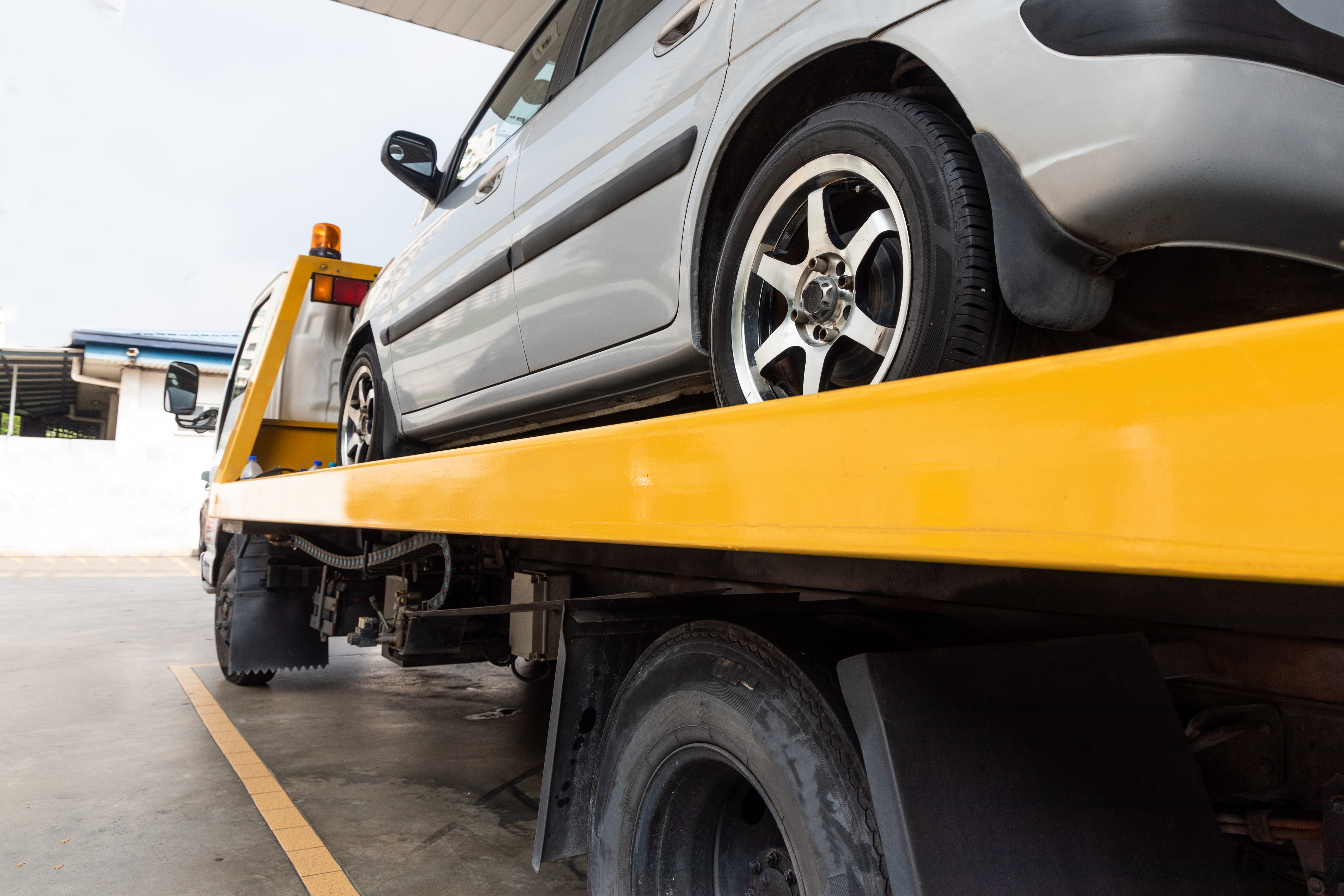 A jdm car on a transport truck.