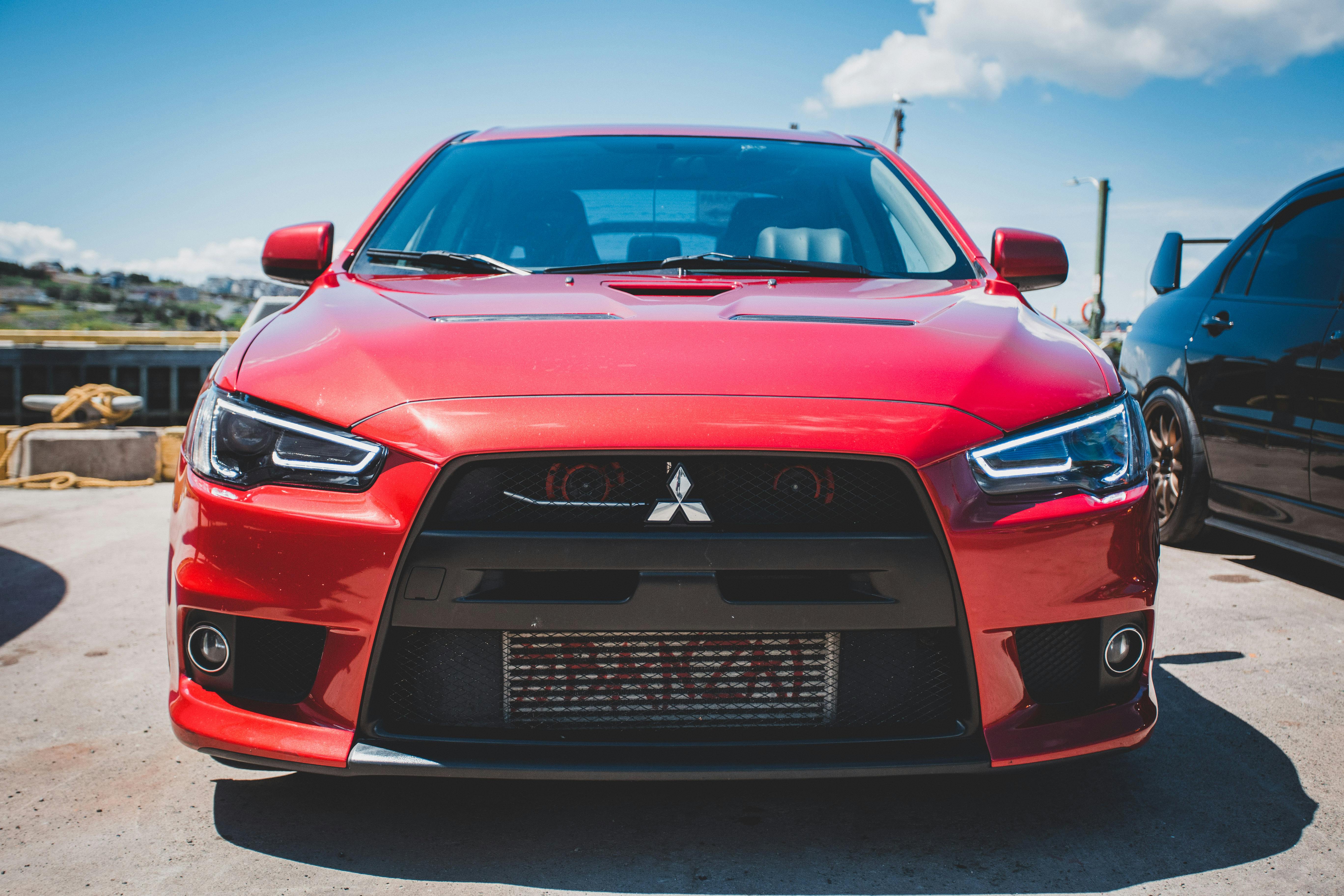 A red Mitsubishi Lancer Evolution - one of the top JDM cars.